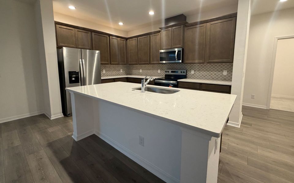 Furnished interior view inside a new home in Trinity Gardens, Deland (Image 6).