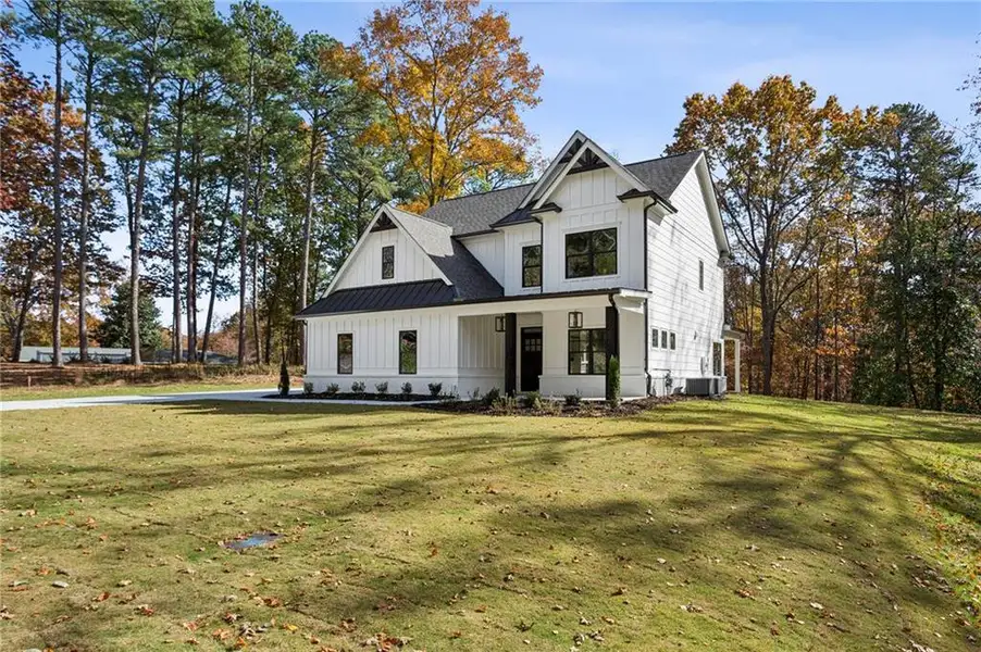 Front exterior of a new home in , Marietta, GA, highlighting curb appeal (Image 1). Front exterior of a new home in , Marietta, GA, highlighting curb appeal (Image 1).