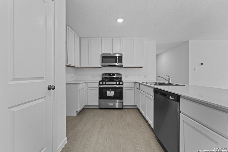 Furnished interior view inside a new home in Torian Village: Watermill Collection, San Antonio (Image 4).