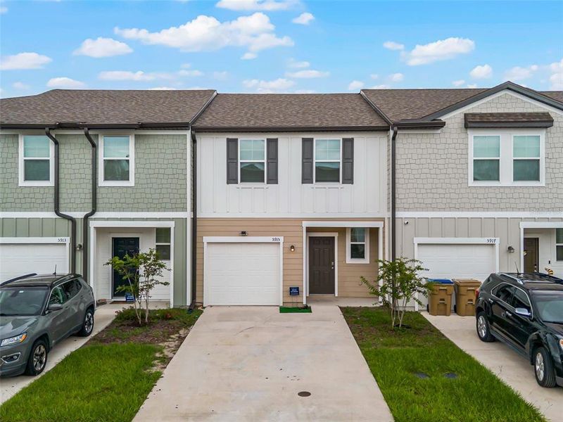 Front exterior of a new home in Ashford Place, St. Cloud, FL, highlighting curb appeal (Image 1). Front exterior of a new home in Ashford Place, St. Cloud, FL, highlighting curb appeal (Image 1).