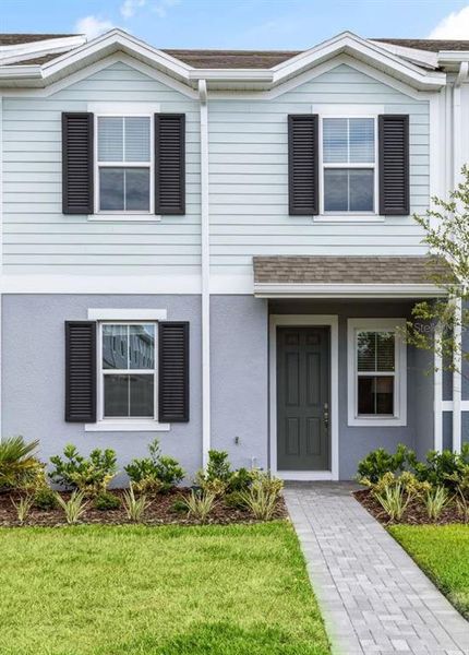 Front exterior of a new home in The Residences at Emerson Park, Apopka, FL, highlighting curb appeal (Image 1). Front exterior of a new home in The Residences at Emerson Park, Apopka, FL, highlighting curb appeal (Image 1).