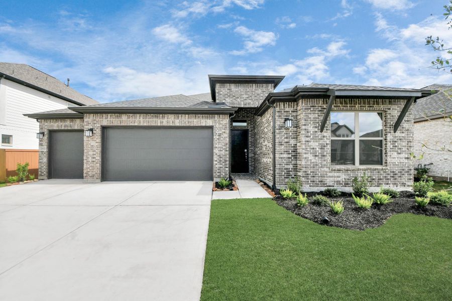 Front exterior of a new home in Marvida, Cypress, TX, highlighting curb appeal (Image 2).