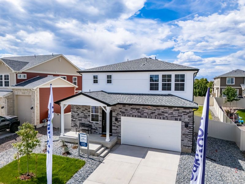 Front exterior of a new home in Thompson River Ranch, Johnstown, CO, highlighting curb appeal (Image 19).