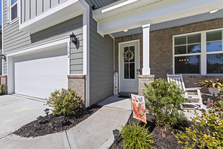 Front exterior of a new home in The Ponds, Summerville, SC, highlighting curb appeal (Image 21).