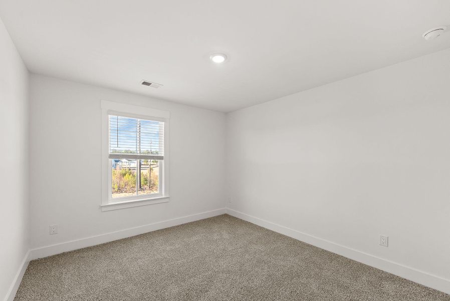 Spacious, unfurnished interior of a new home in The Coves at Lakes of Cane Bay, Summerville (Image 43). Spacious, unfurnished interior of a new home in The Coves at Lakes of Cane Bay, Summerville (Image 43).
