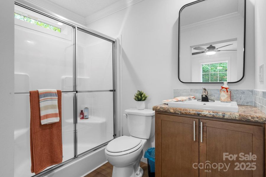 Full En suite bath with stand up shower just off the primary bedroom