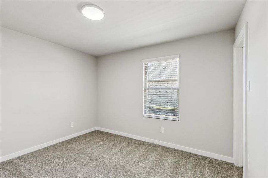 Bedroom in the Harper home plan by Trophy Signature Homes – REPRESENTATIVE PHOTO