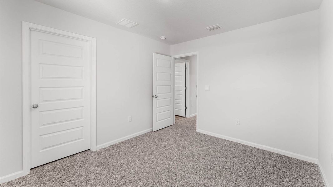Representative unfurnished interior of a home built from the The Aisle by D.R. Horton in Chateau Nemours, Port Saint Joe (Image 32).