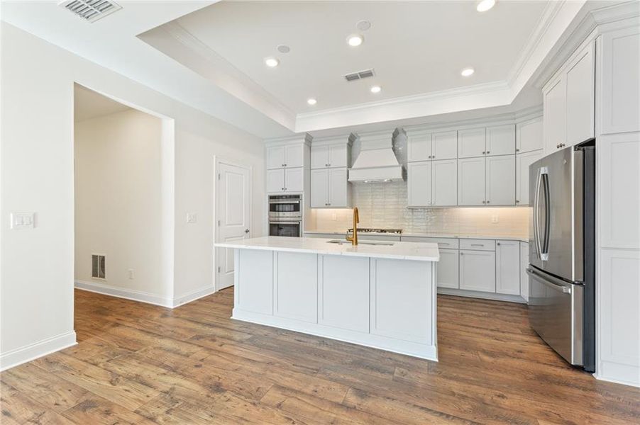 Furnished interior view inside a new home in The Courtyards of Franklin Goldmine, Cumming (Image 5).
