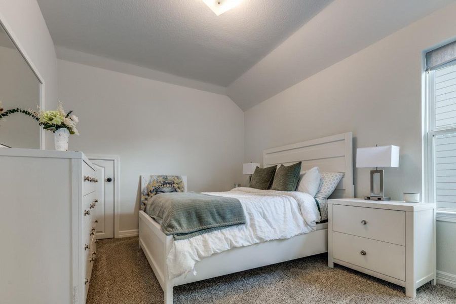 It has a soft carpeted floor and a window allowing natural light. Perfect for relaxation.