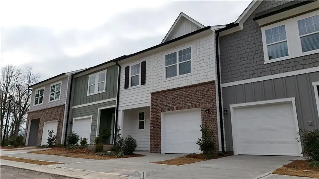 Front exterior of a new home in Kingston Cove, Auburn, GA, highlighting curb appeal (Image 6).