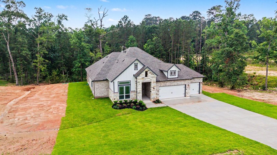 Front exterior of a new home in Rose Hill Estates, Willis, TX, highlighting curb appeal (Image 20).