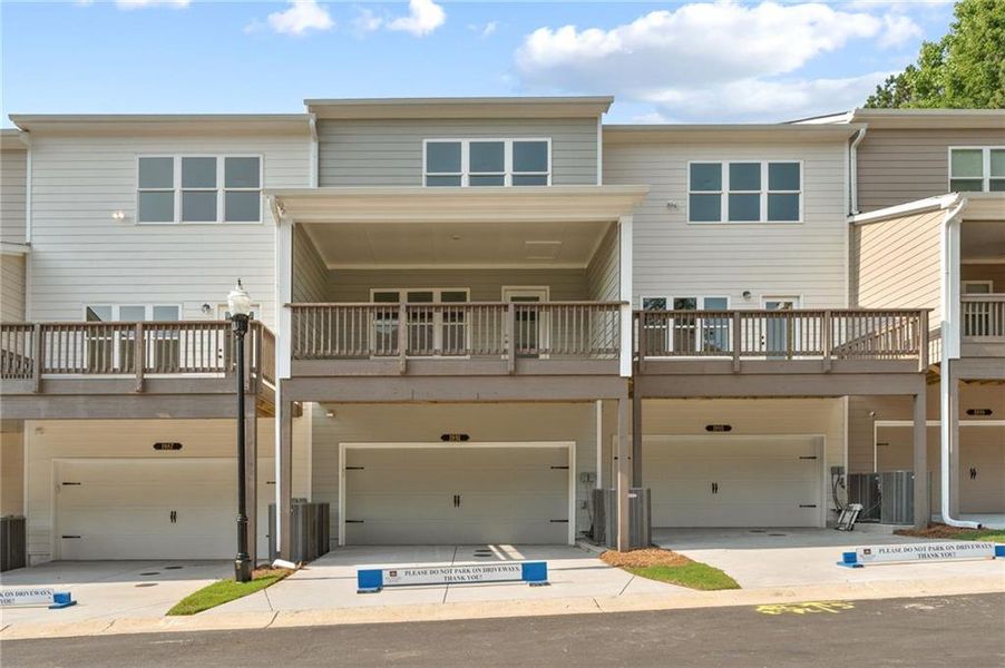 Front exterior of a new home in Townes at South Main, Kennesaw, GA, highlighting curb appeal (Image 24).