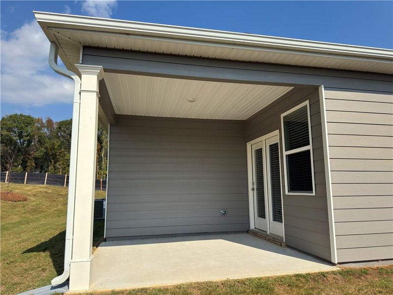 Exterior details and patio area of a home in Oakchase at Hampton, Hampton (Image 1).