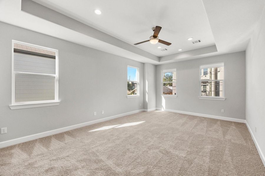 Your primary bedroom provides a serene retreat with generous space, natural light, and the perfect setting to unwind. Image depicts similar floorplan in another ROC Homes Community. Your primary bedroom provides a serene retreat with generous space, natural light, and the perfect setting to unwind. Image depicts similar floorplan in another ROC Homes Community.