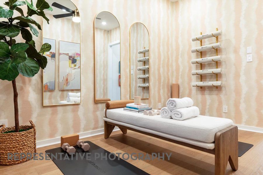 Living area with baseboards and wood finished floors