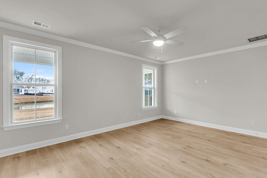 Spacious, unfurnished interior of a new home in Tidewater at Lakes of Cane Bay, Summerville (Image 43).