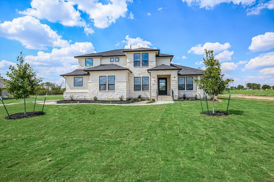 Representative exterior photo of a completed home built from the Vanderpool II by Giddens Homes in Whispering Wind, Bertram, TX (Image 34).