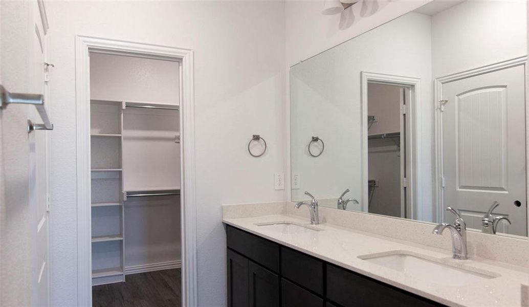 Bathroom featuring hardwood / wood-style floors and vanity