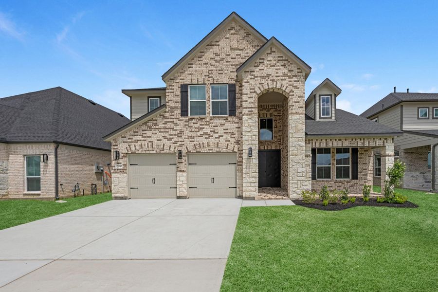Front exterior of a new home in Morton Creek Ranch, Katy, TX, highlighting curb appeal (Image 22).