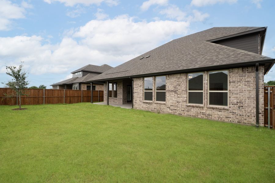 Exterior details and patio area of a home in Enclave at Legacy Hills, Celina (Image 2). Exterior details and patio area of a home in Enclave at Legacy Hills, Celina (Image 2).