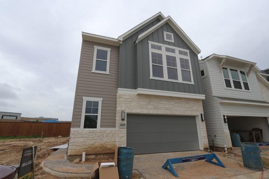 Front exterior of a new home in Retreat at Oak Park, Houston, TX, highlighting curb appeal (Image 13).