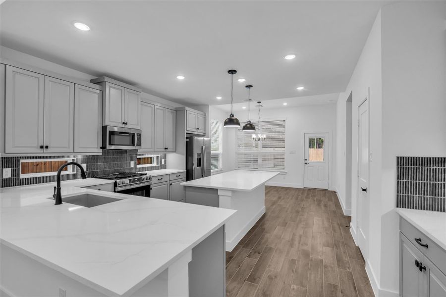 The Hub of the home features so Much, Large Quartz Countertops, Lots of Cabinetry. Wonderful design selection
