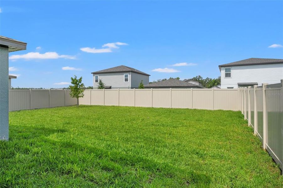 Front exterior of a new home in Two Rivers - Classic Series, Zephyrhills, FL, highlighting curb appeal (Image 25).