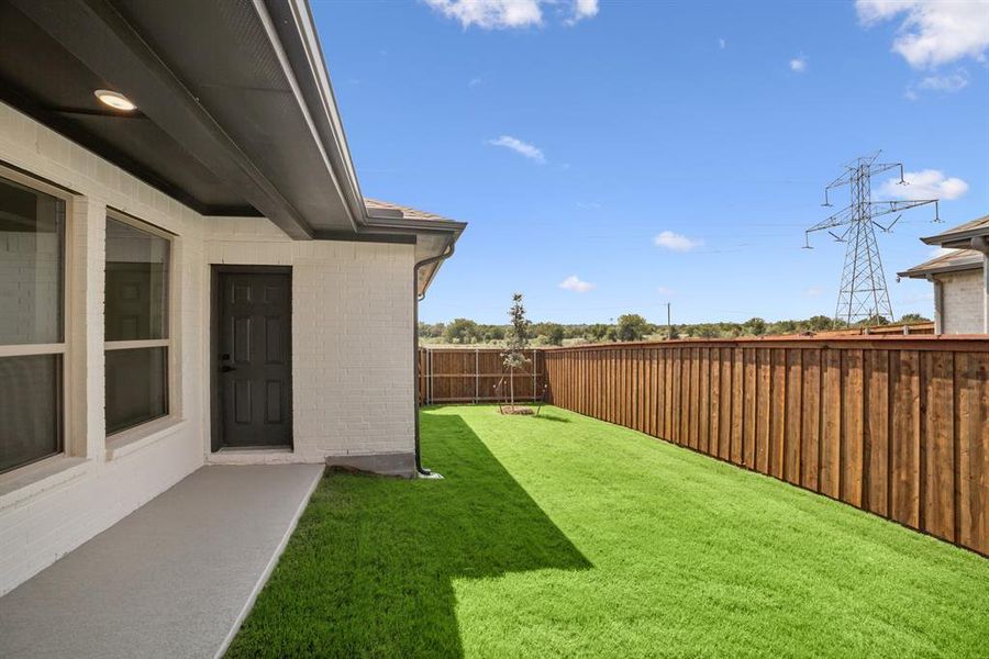 Exterior details and patio area of a home in Karis - Village Series, Crowley (Image 2). Exterior details and patio area of a home in Karis - Village Series, Crowley (Image 2).