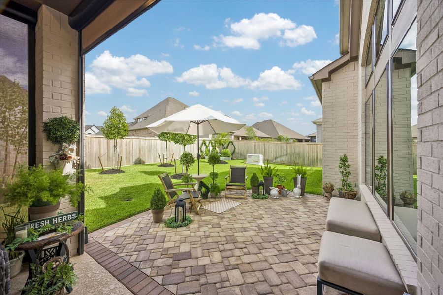 Exterior details and patio area of a home in Prairieland Village - Summit Collection, Cypress (Image 20).