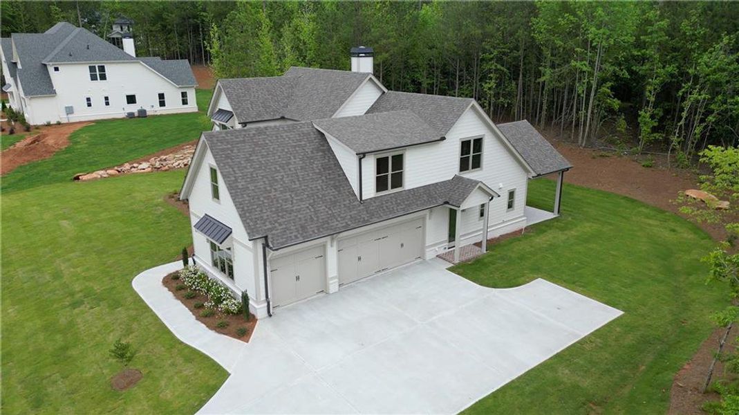 Front exterior of a new home in , Newnan, GA, highlighting curb appeal (Image 32). Front exterior of a new home in , Newnan, GA, highlighting curb appeal (Image 32).