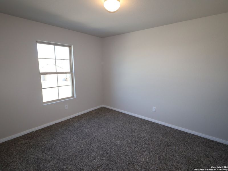 Spacious, unfurnished interior of a new home in Hunters Ranch, San Antonio (Image 20).