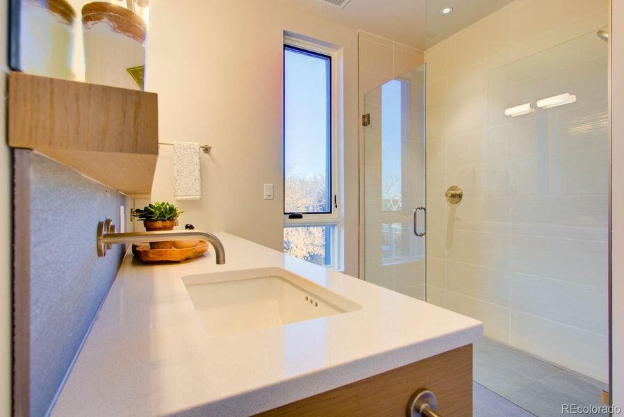 Primary Bathroom Suite, oversized shower, Quartz countertops, *Similar floor plan, finishes and feel at L'Avenir! (Picture is not of the actual build)