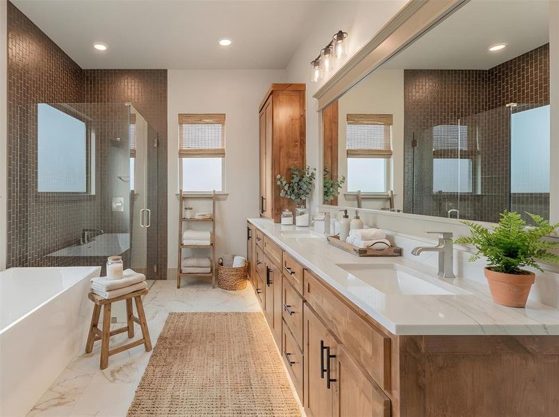 Primary ensuite with soaking tub, separate shower and dual sinks