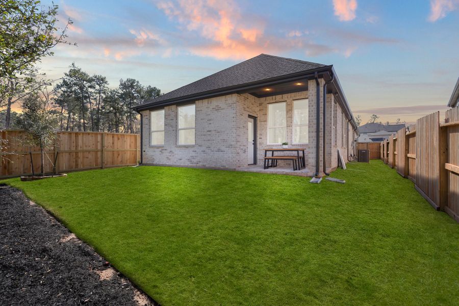 Front exterior of a new home in The Woodlands Hills, Willis, TX, highlighting curb appeal (Image 18). Front exterior of a new home in The Woodlands Hills, Willis, TX, highlighting curb appeal (Image 18).