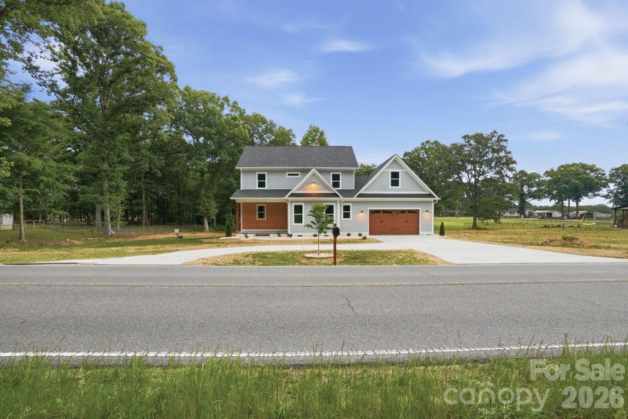 Front exterior of a new home in , Marshville, NC, highlighting curb appeal (Image 26).