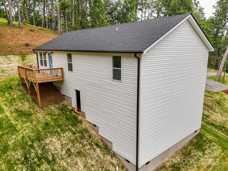 Front exterior of a new home in , Columbus, NC, highlighting curb appeal (Image 18).