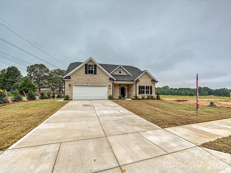 Front exterior of a new home in , Waxhaw, NC, highlighting curb appeal (Image 24).