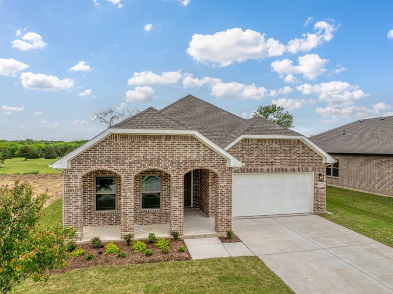 Representative exterior photo of a completed home built from the Norwood by Stonehollow Homes in Heritage Grove, Blue Ridge, TX (Image 1). Representative exterior photo of a completed home built from the Norwood by Stonehollow Homes in Heritage Grove, Blue Ridge, TX (Image 1).