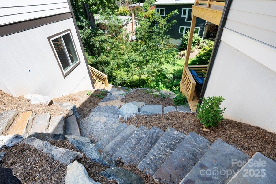 Professional Landscaping Includes Exterior Steps and Big-Boulder Accents Professional Landscaping Includes Exterior Steps and Big-Boulder Accents