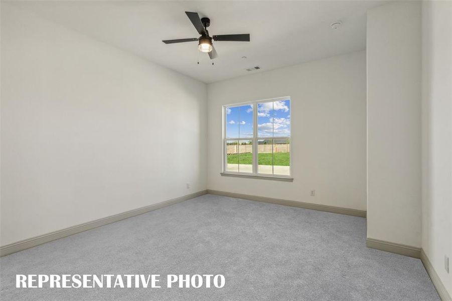 This peaceful and relaxing, main floor owner's bedroom is the perfect place for you to relax and unwind at the end of the day.  REPRESENTATIVE PHOTO