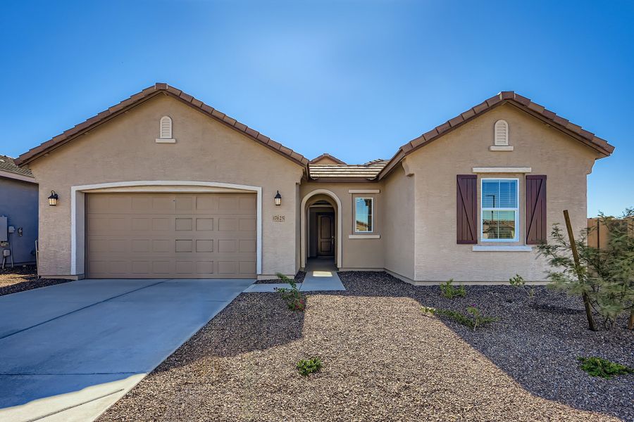 Front exterior of a new home in El Cidro Signature, Goodyear, AZ, highlighting curb appeal (Image 1). Front exterior of a new home in El Cidro Signature, Goodyear, AZ, highlighting curb appeal (Image 1).