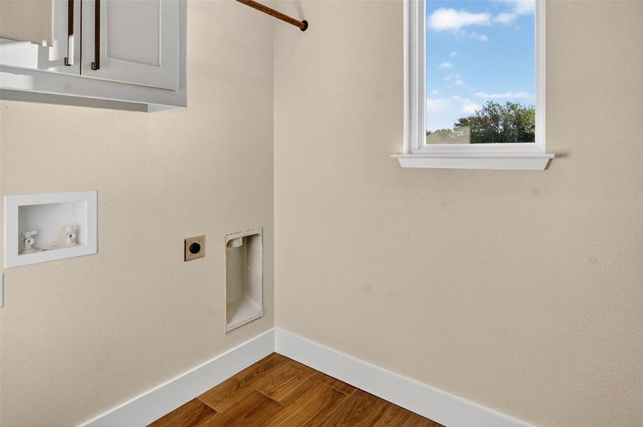 full size utility room with custom cabinets and a drip dry area.