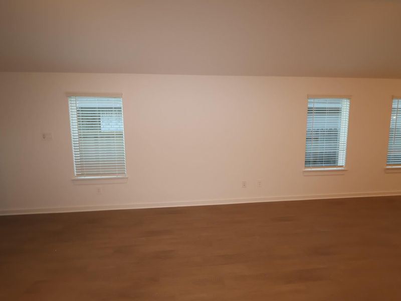 Spacious, unfurnished interior of a new home in Pinewood at Grand Texas, New Caney (Image 8).