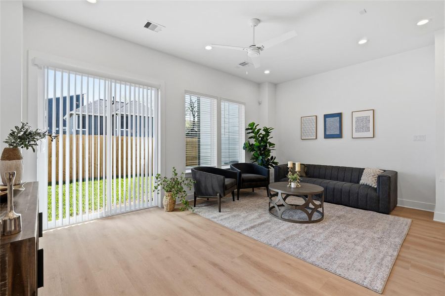Dining area filled with natural light and direct access to the backyard through sliding glass doors.