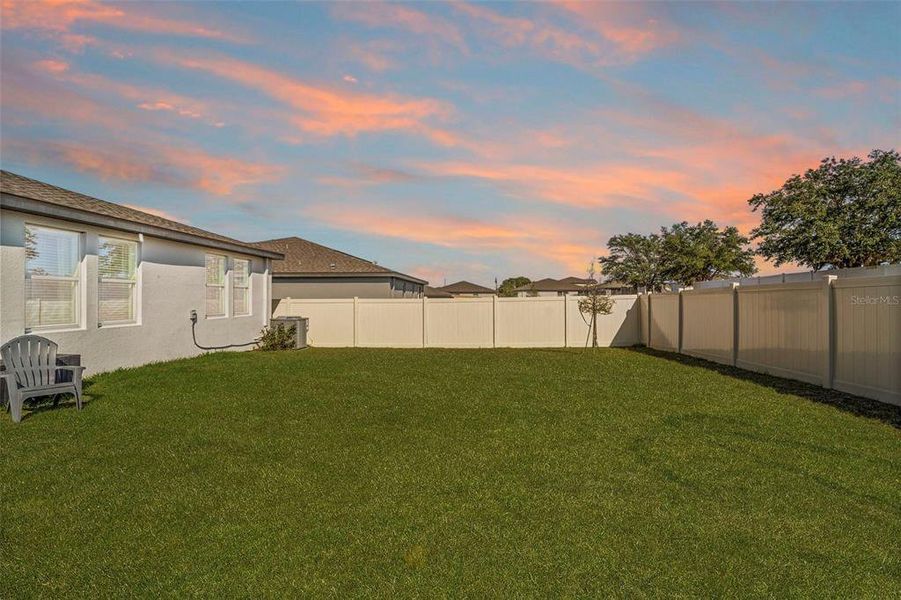 Exterior details and patio area of a home in Deer Run at Crosswinds, Davenport (Image 30).