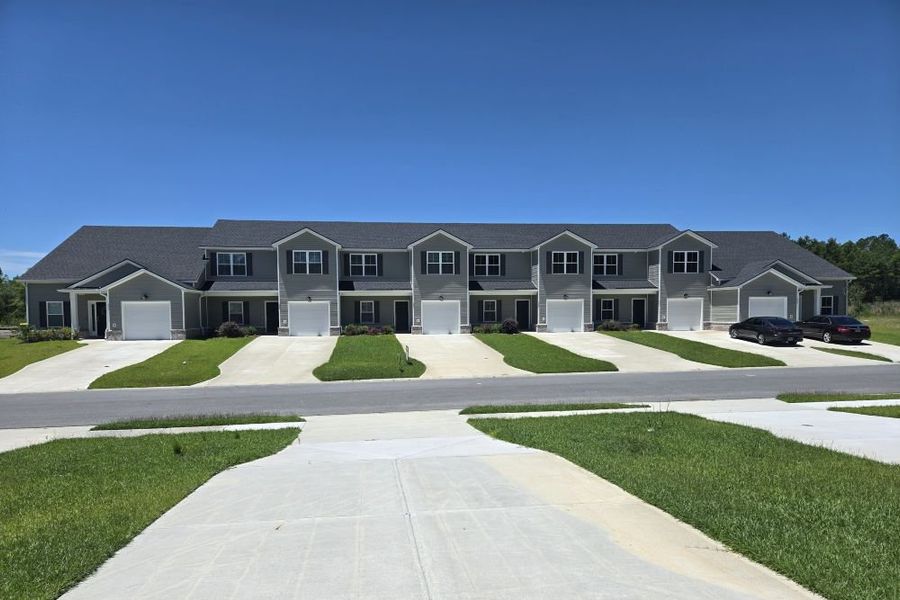 Front exterior of a new home in New Haven At Belmont Glen, Guyton, GA, highlighting curb appeal (Image 23). Front exterior of a new home in New Haven At Belmont Glen, Guyton, GA, highlighting curb appeal (Image 23).