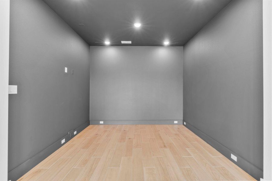 The spacious game room connects to a media room. Representative image.