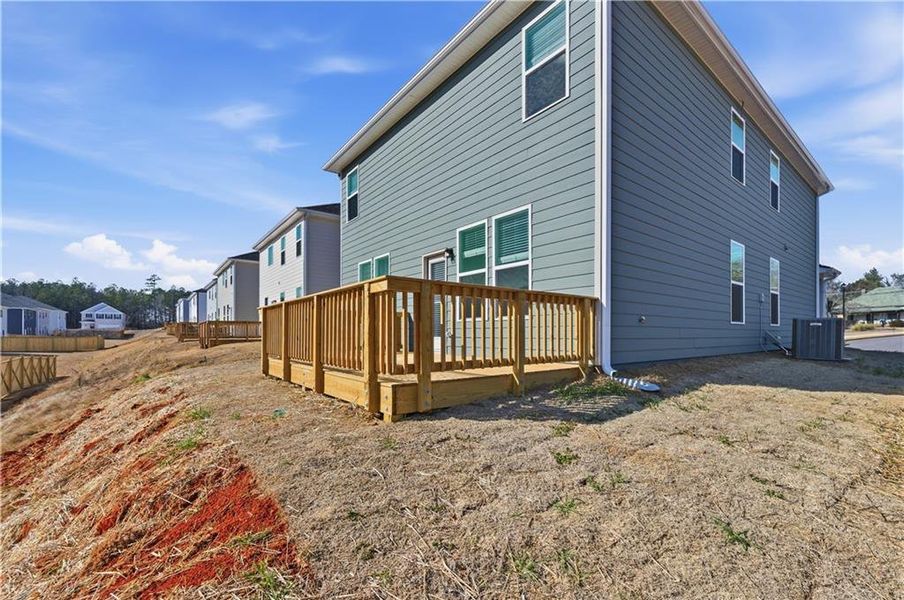 Exterior details and patio area of a home in Enclave at Evergreen, Fairburn (Image 3).