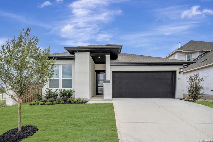 Front exterior of a new home in Mayfair - Select Classic Series, New Braunfels, TX, highlighting curb appeal (Image 2). Front exterior of a new home in Mayfair - Select Classic Series, New Braunfels, TX, highlighting curb appeal (Image 2).